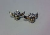 Brinco de caveiras + strass